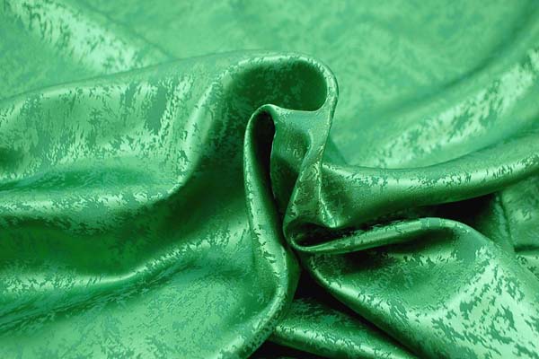 イベントや衣装に最適な光沢感のある素材　ポリエステルジャガード　炎の柄　緑  