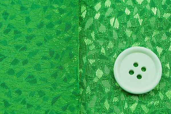 イベントや衣装に最適な光沢感のある素材　ポリエステルジャガード　モザイク柄　グリーン  