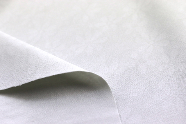 ハイテンションニット レース柄プリント 灰白色 裏面の質感