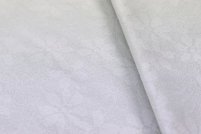 ハイテンションニット レース柄プリント 灰白色 柄アップ