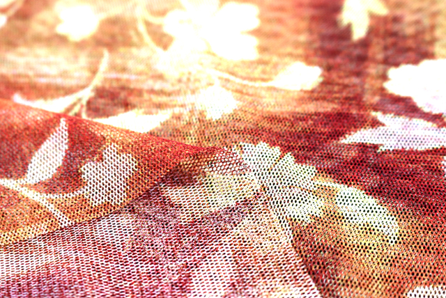 チュールニット ぼかしプリント花柄 オレンジ系 生地アップ