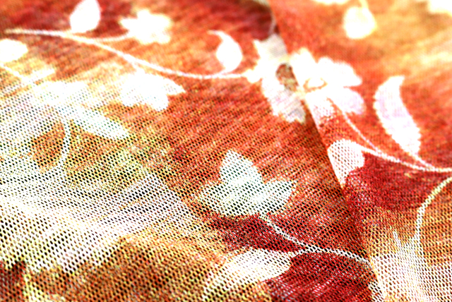 チュールニット ぼかしプリント花柄 オレンジ系 透け感イメージ